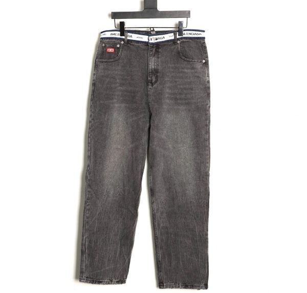 Balenciaga's lettering and tape waistband jeans